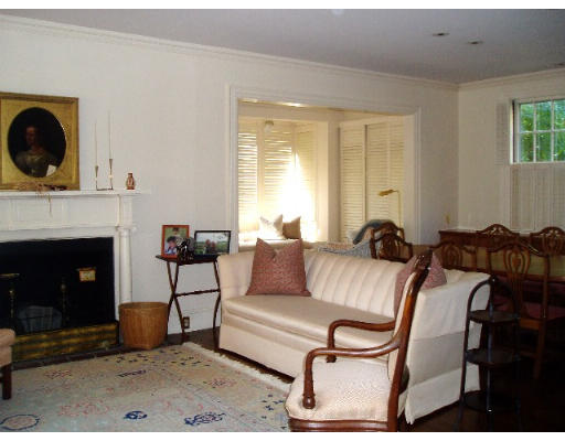 26 Chesham Road Brookline, MA 02445 - Photo 3 of 4 a living room with furniture a flat screen tv and a fireplace
