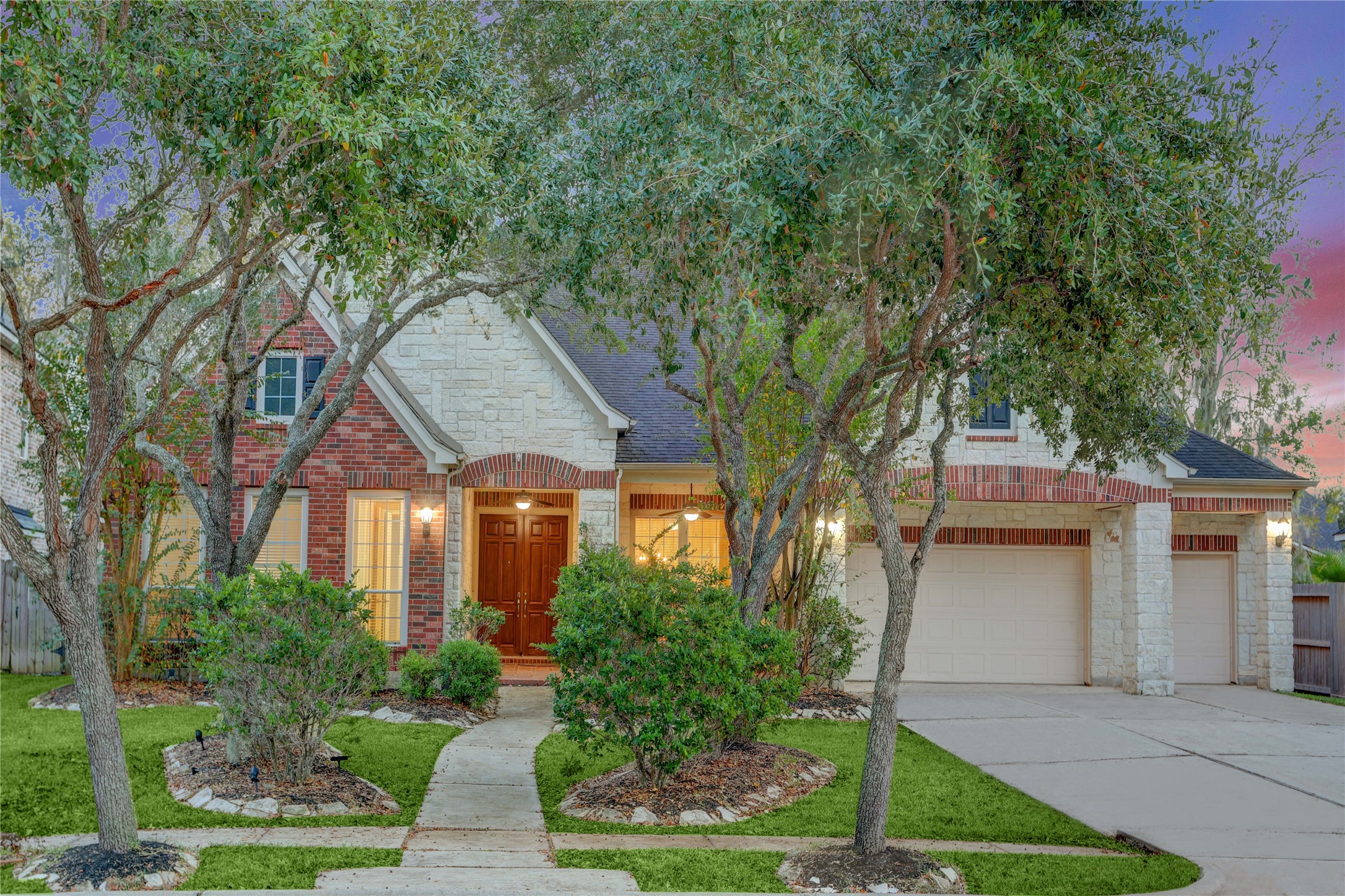 a front view of a house with garden