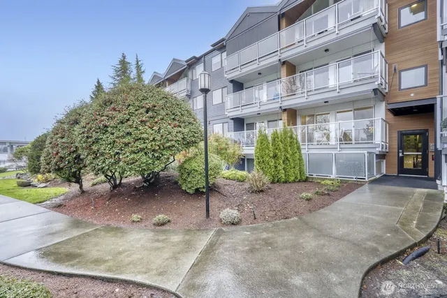 a view of a building with a yard