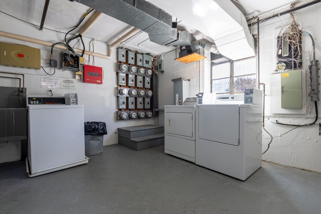 186 Lexington Street, Unit 3 Watertown, MA 02472 - Photo 11 of 12 a kitchen that has a lot of white cabinets and stainless steel appliances