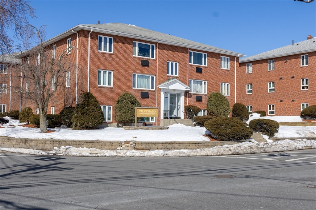186 Lexington Street, Unit 3 Watertown, MA 02472 - Photo 2 of 12 a front view of a house with a yard