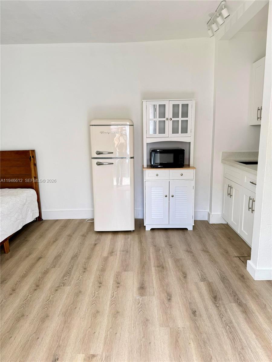 541 East 38th Street, Unit E Hialeah, FL 33013 - Photo 2 of 11 a view of a room with a cabinet and mirror