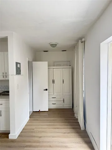 a view of a livingroom with wooden floor
