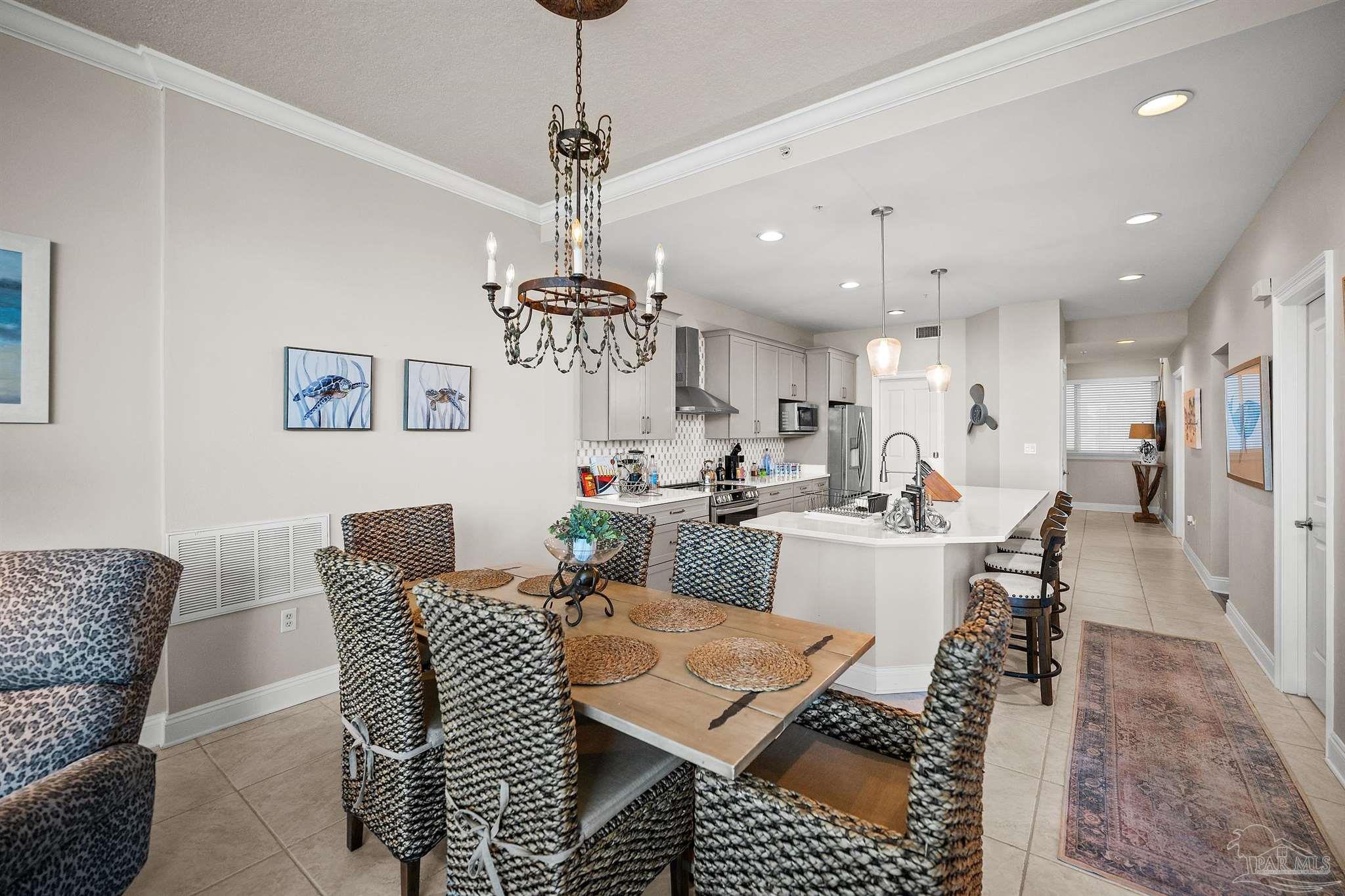 28250 Canal Road, Unit 205 Orange Beach, AL 36561 - Photo 18 of 60 a view of a dining room with furniture