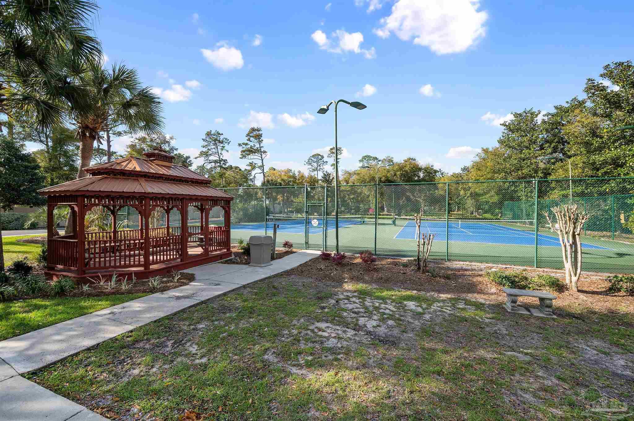 28250 Canal Road, Unit 205 Orange Beach, AL 36561 - Photo 48 of 60 a view of a house with backyard and porch