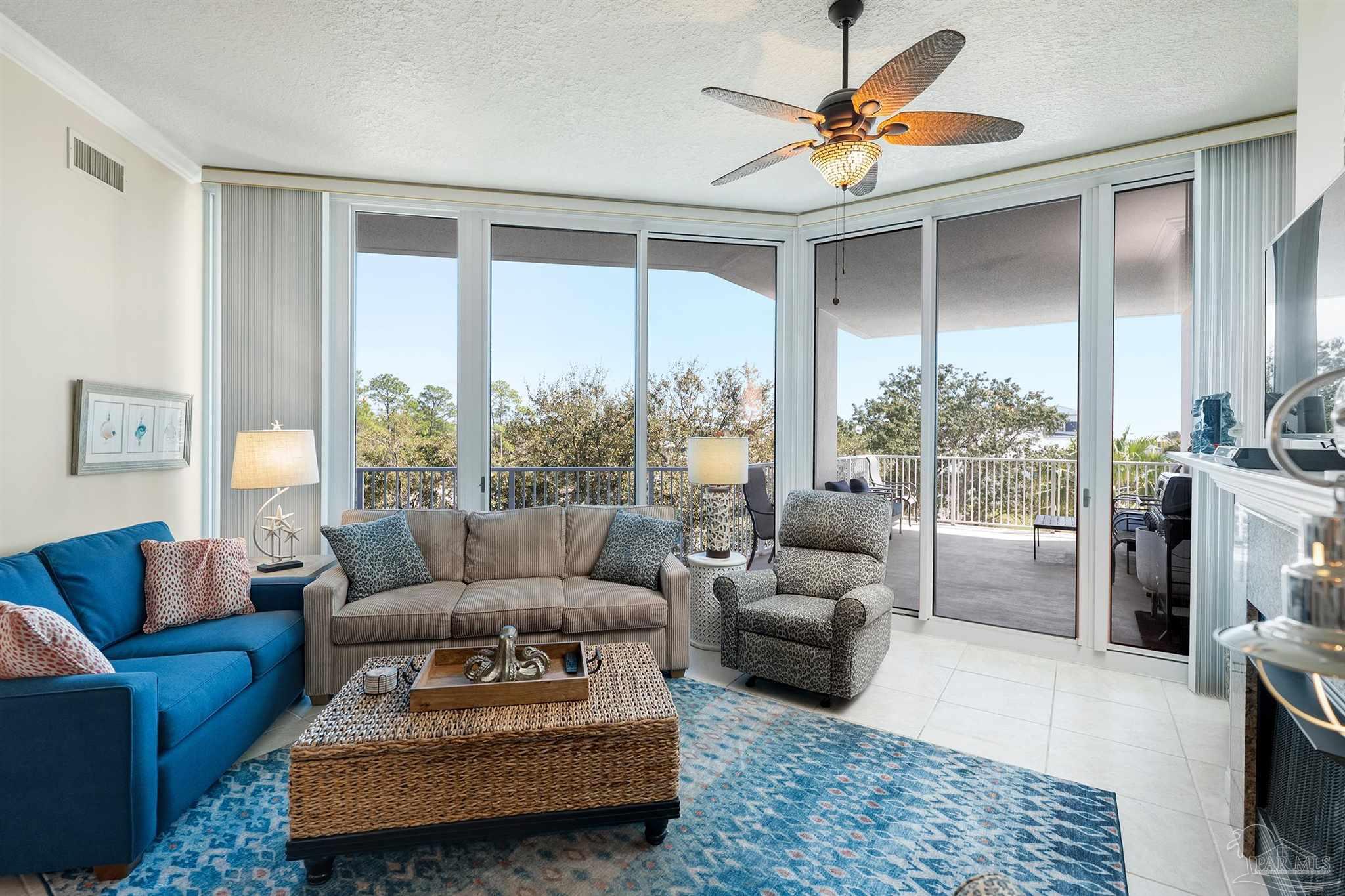 28250 Canal Road, Unit 205 Orange Beach, AL 36561 - Photo 7 of 60 a living room with furniture and a large window