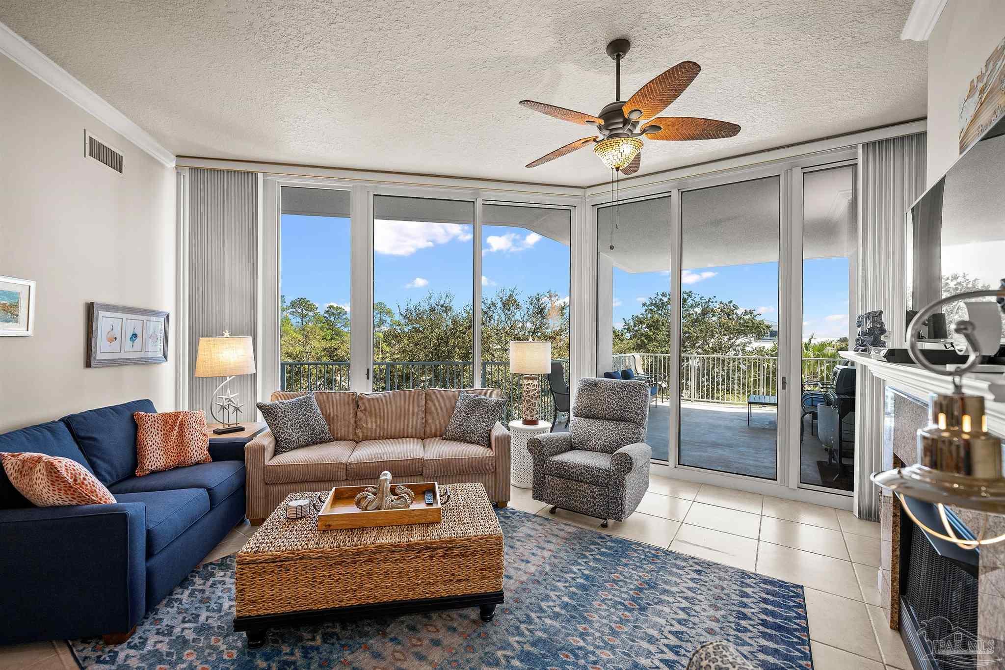 28250 Canal Road, Unit 205 Orange Beach, AL 36561 - Photo 9 of 60 a living room with furniture and a large window