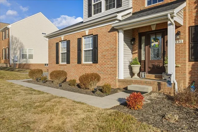 a view of a bedroom with wooden floor