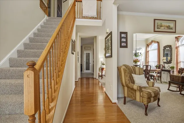 a view of a dining room with furniture and chandelier