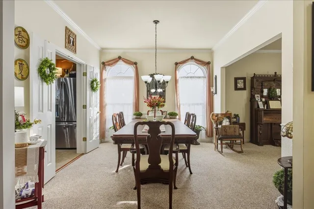 a living room with furniture a fireplace and a window