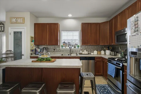 a dining room with furniture and a chandelier