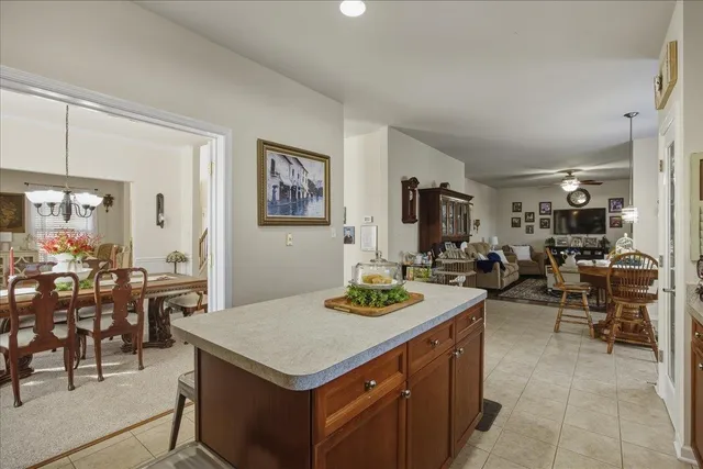 a kitchen with wooden cabinets sink and stainless steel appliances