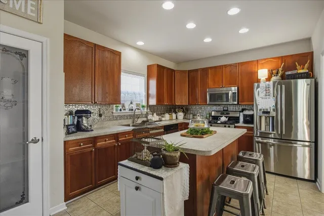 a very nice looking room with wooden floor and a bathroom