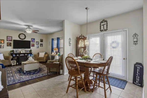 a bathroom with a granite countertop toilet a sink and a shower