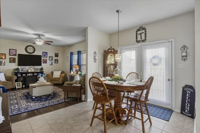 a bathroom with a granite countertop toilet a sink and a shower