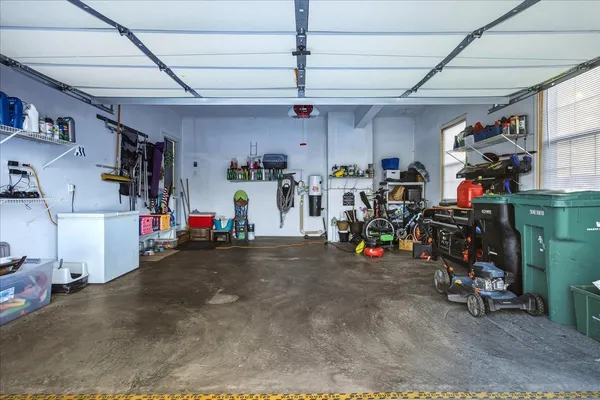 a white toilet sitting next to a bathroom sink and vanity