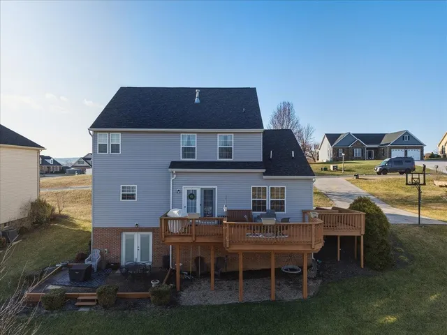 a backyard of a house with outdoor seating