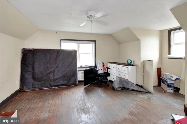 a bedroom with furniture and window