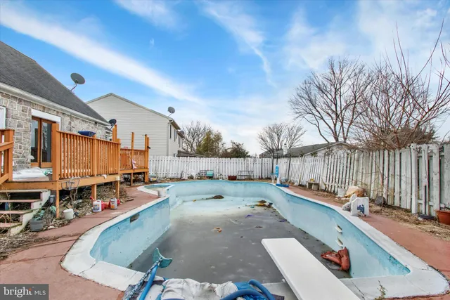 a view of a swimming pool with a lounge chairs