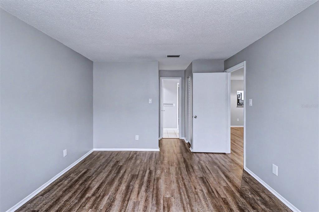 3661 Trophy Boulevard, Unit 3661 New Port Richey, FL 34655 - Photo 12 of 25 a view of room with wooden floor