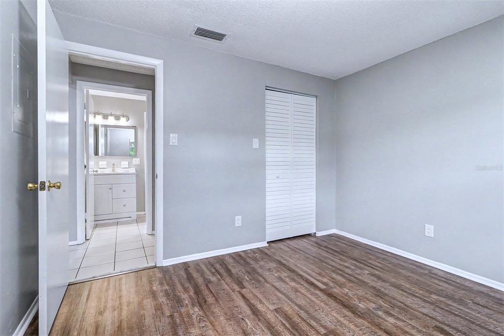 3661 Trophy Boulevard, Unit 3661 New Port Richey, FL 34655 - Photo 15 of 25 wooden floor in an empty room