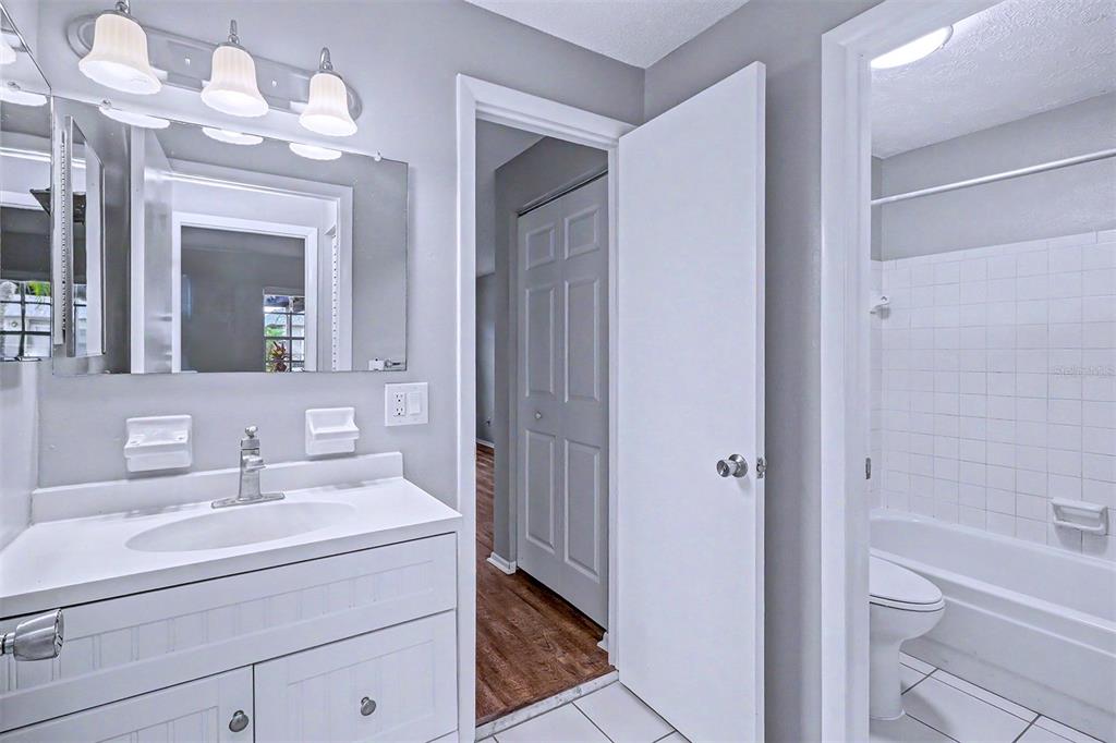 3661 Trophy Boulevard, Unit 3661 New Port Richey, FL 34655 - Photo 17 of 25 a bathroom with a sink a toilet and shower