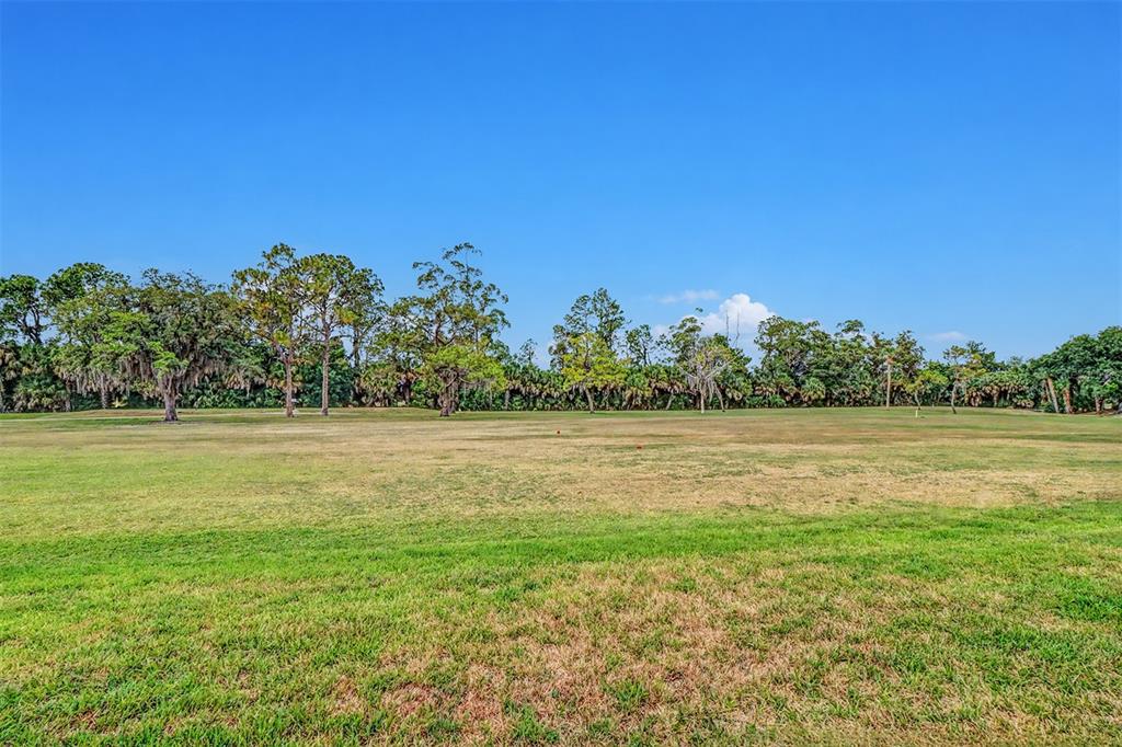 3661 Trophy Boulevard, Unit 3661 New Port Richey, FL 34655 - Photo 20 of 25 a view of lake with houses in the back
