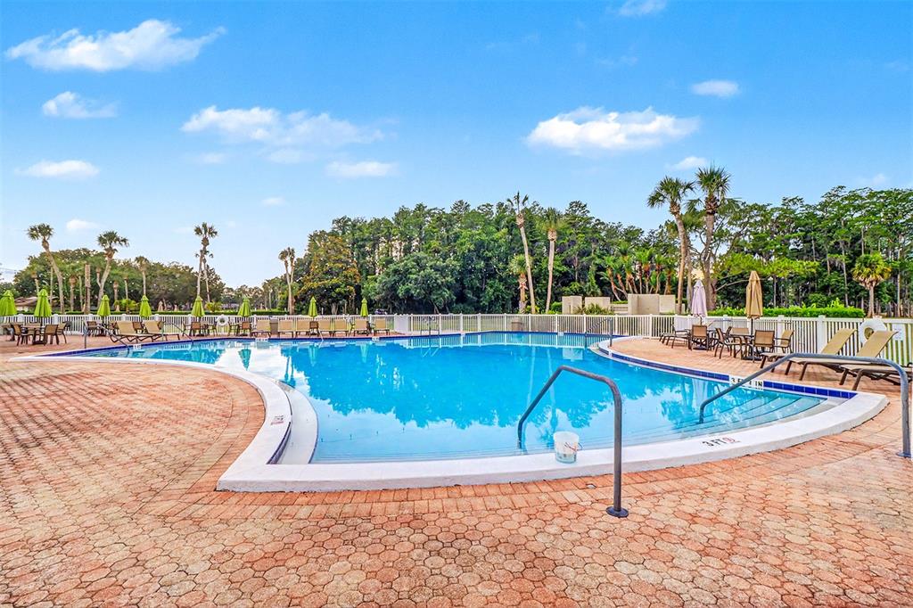 3661 Trophy Boulevard, Unit 3661 New Port Richey, FL 34655 - Photo 25 of 25 a view of a swimming pool with an outdoor seating