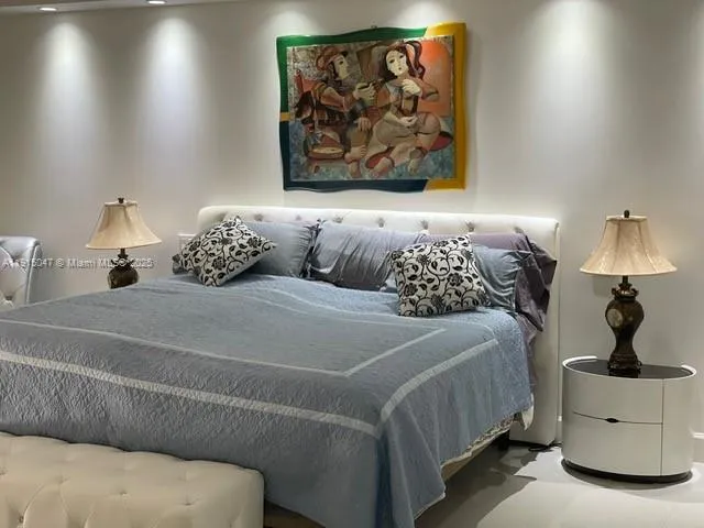 a bedroom with a bed and furniture