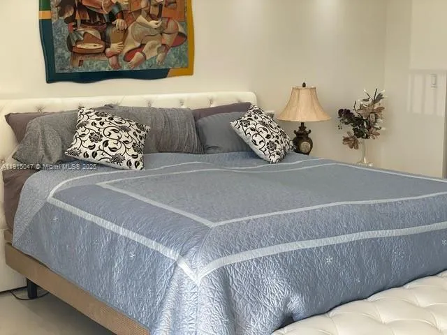 a view of a lake with tall buildings