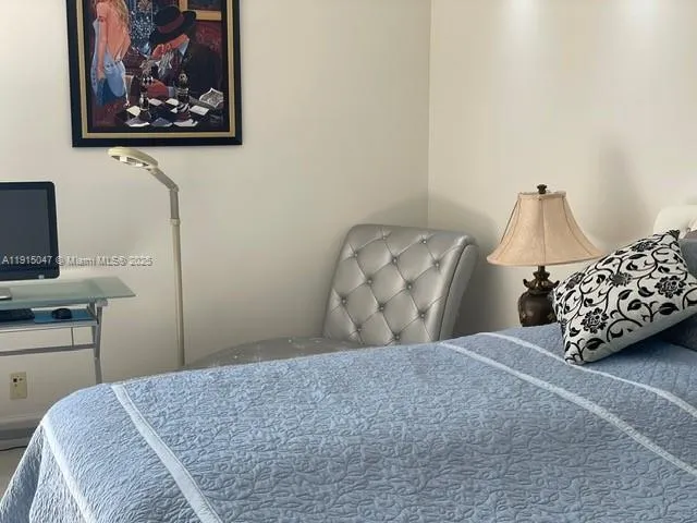 a balcony with table and chairs