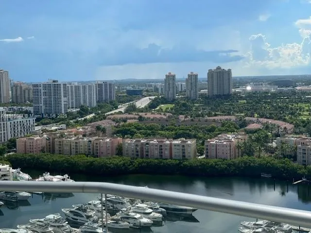 a balcony with chairs and table