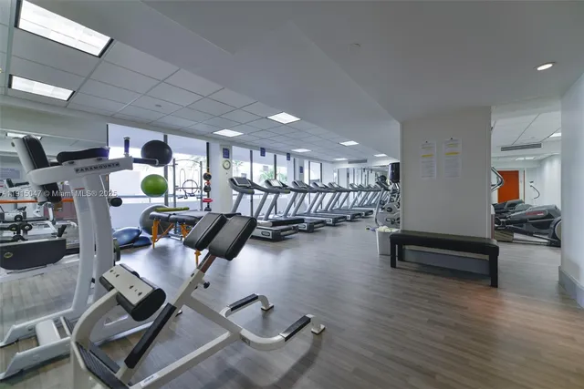 a view of swimming pool with a yard and green space