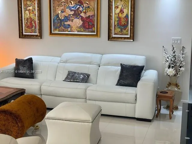 a living room with furniture and a couch