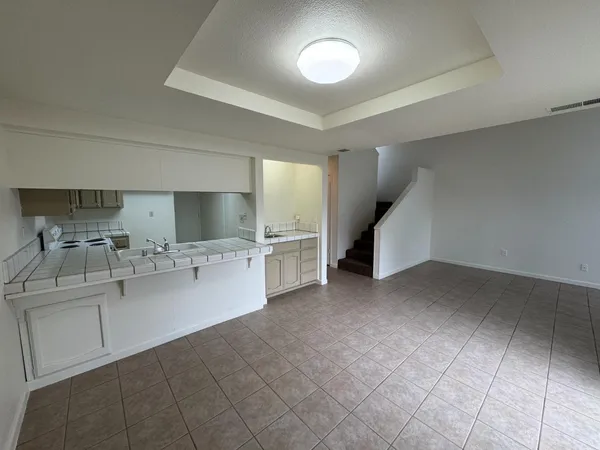 a view of a kitchen with a sink