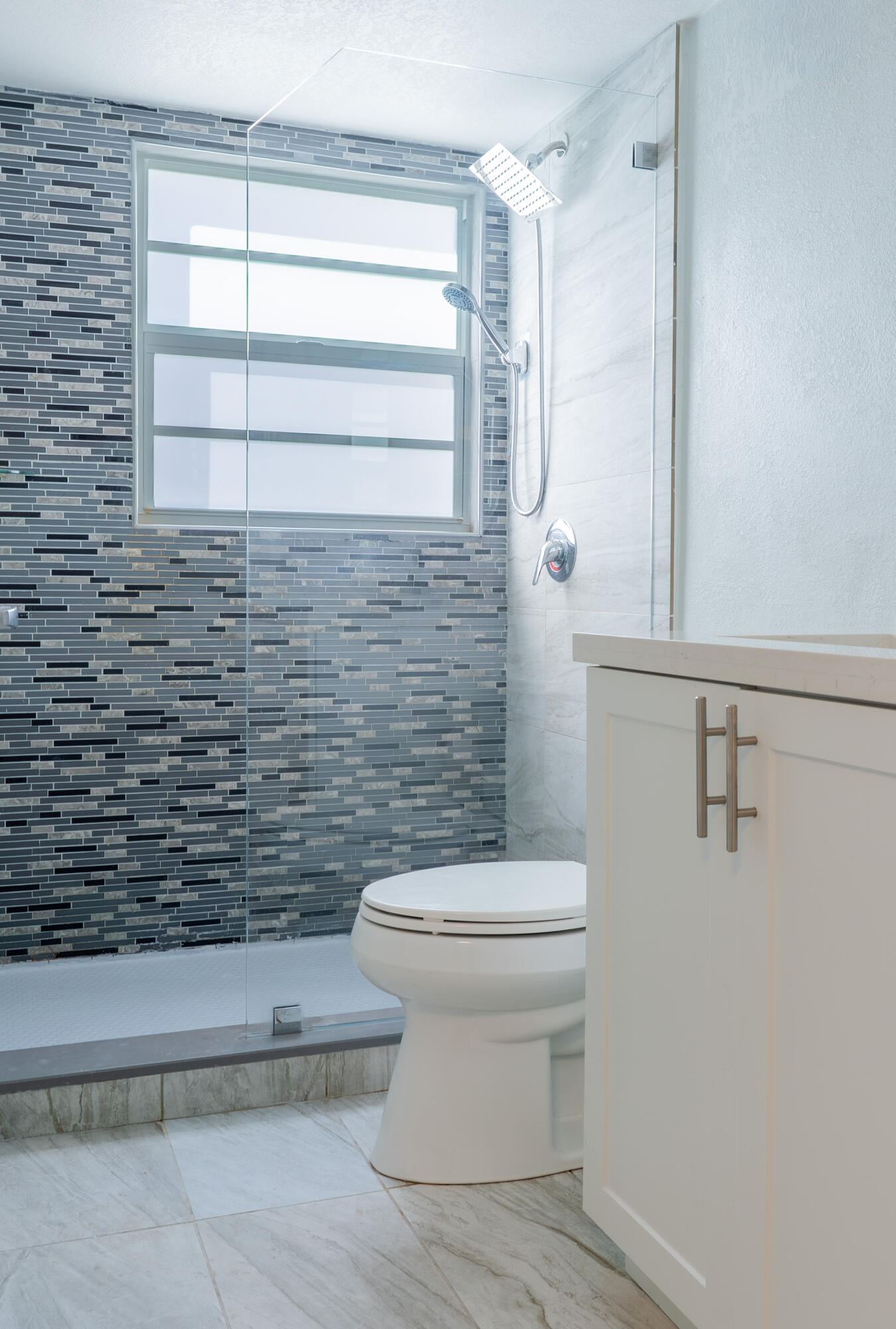 592 Fanshaw O Boca Raton, FL 33434 - Photo 6 of 26 a bathroom with a toilet and a shower