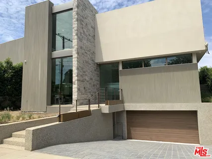 a very nice looking living room with a large window