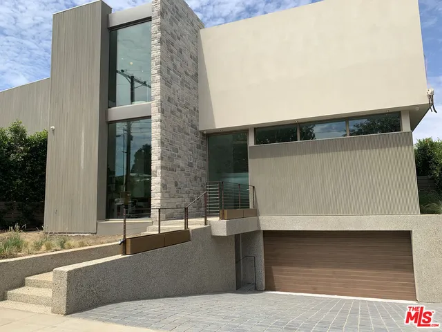a very nice looking living room with a large window