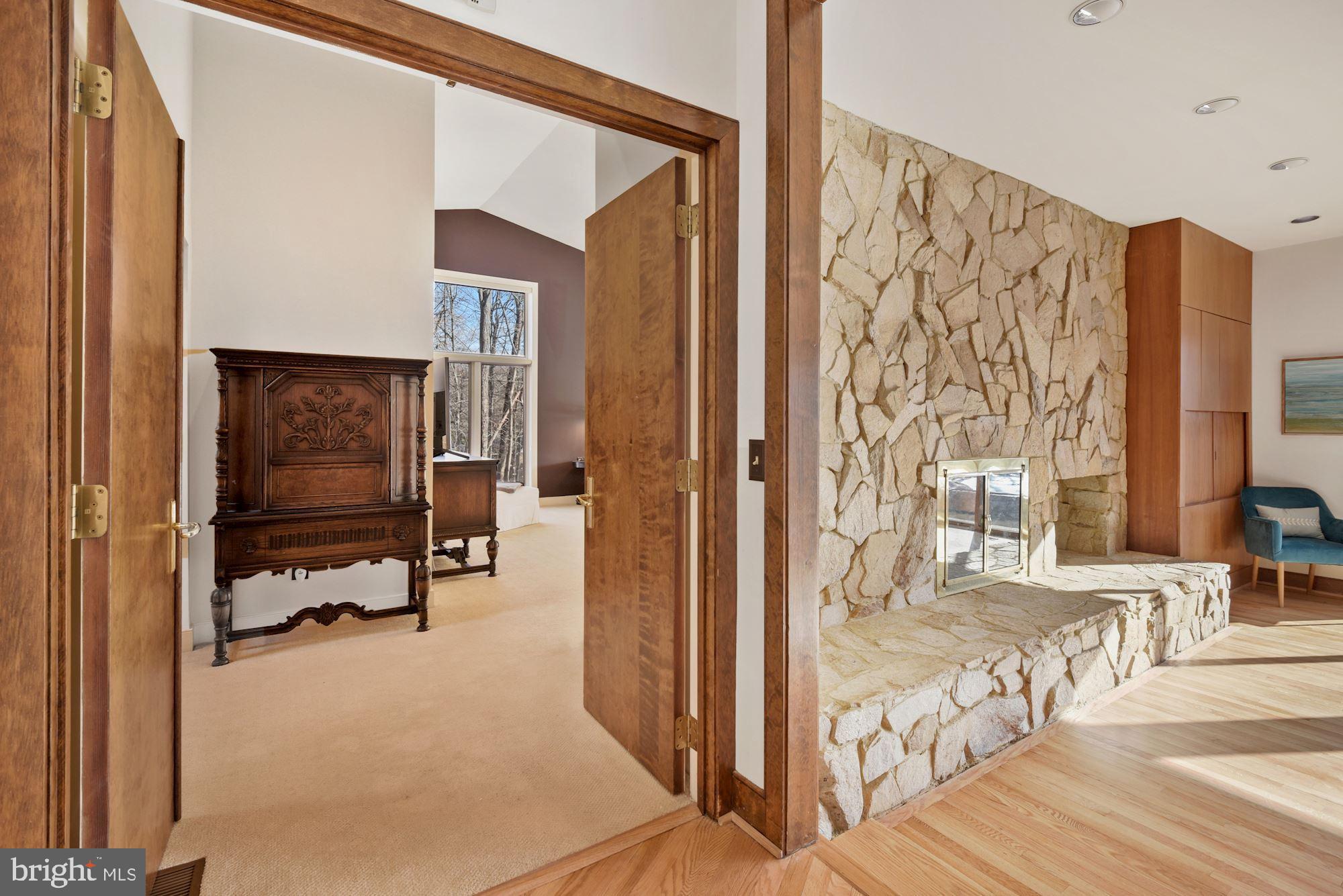 10804 Balantre Lane Potomac, MD 20854 - Photo 22 of 49 Stone Fireplace & double doors to the Master