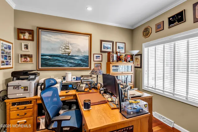 a living room with furniture and large window