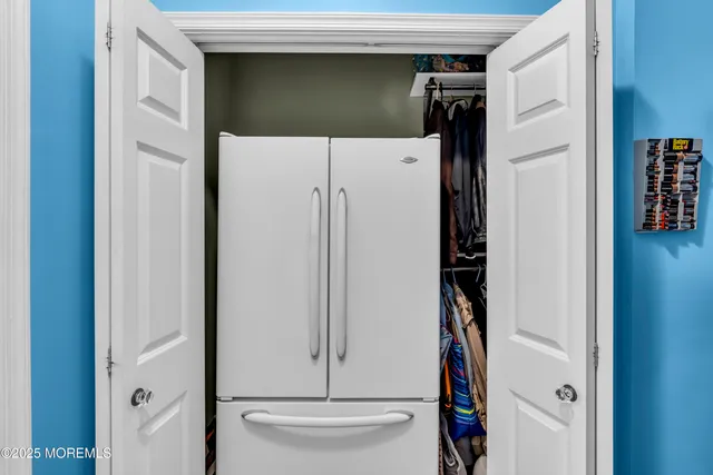 a white refrigerator freezer and a dishwasher