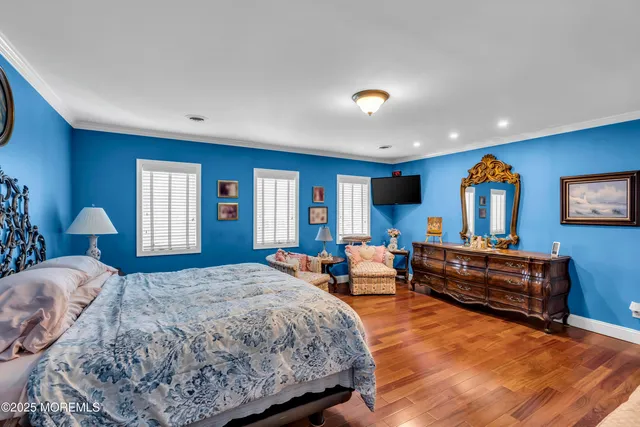 a bed room with a bed and dresser