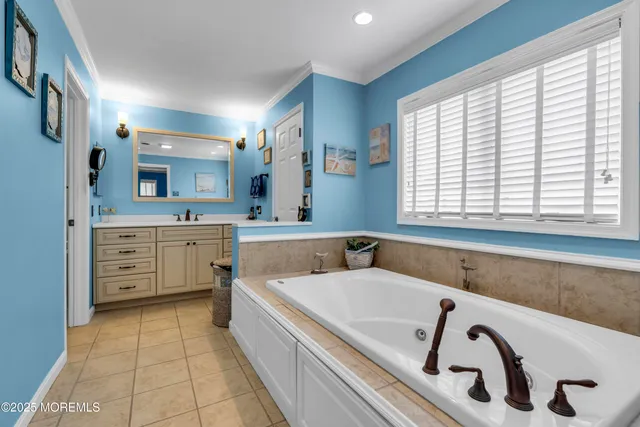 a view of kitchen with stainless steel appliances a sink and cabinets