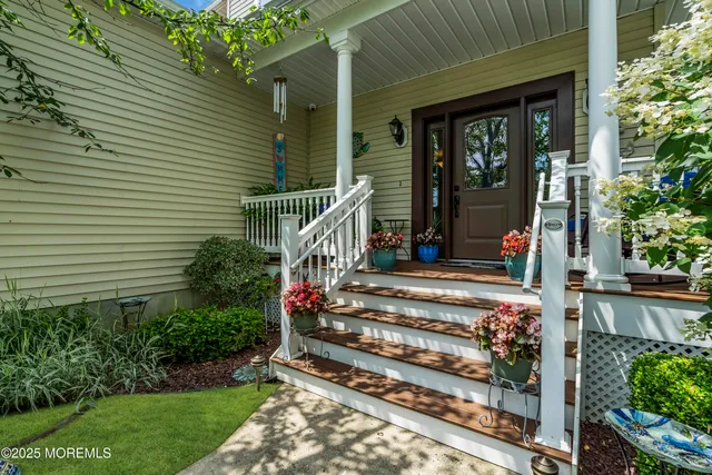 a view of a house with a small yard and plants