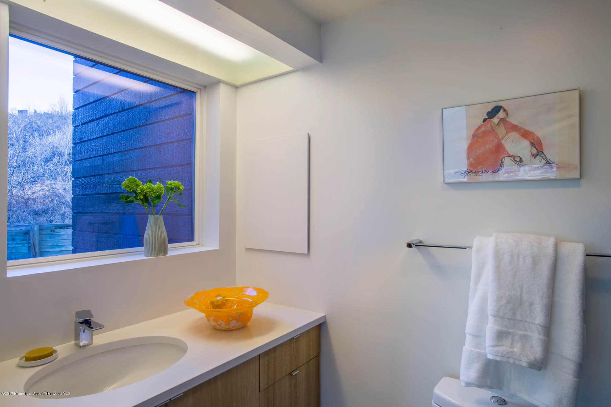 61 Oak Ridge Road Snowmass Village, CO 81615 - Photo 16 of 35 a bathroom with a sink and a mirror