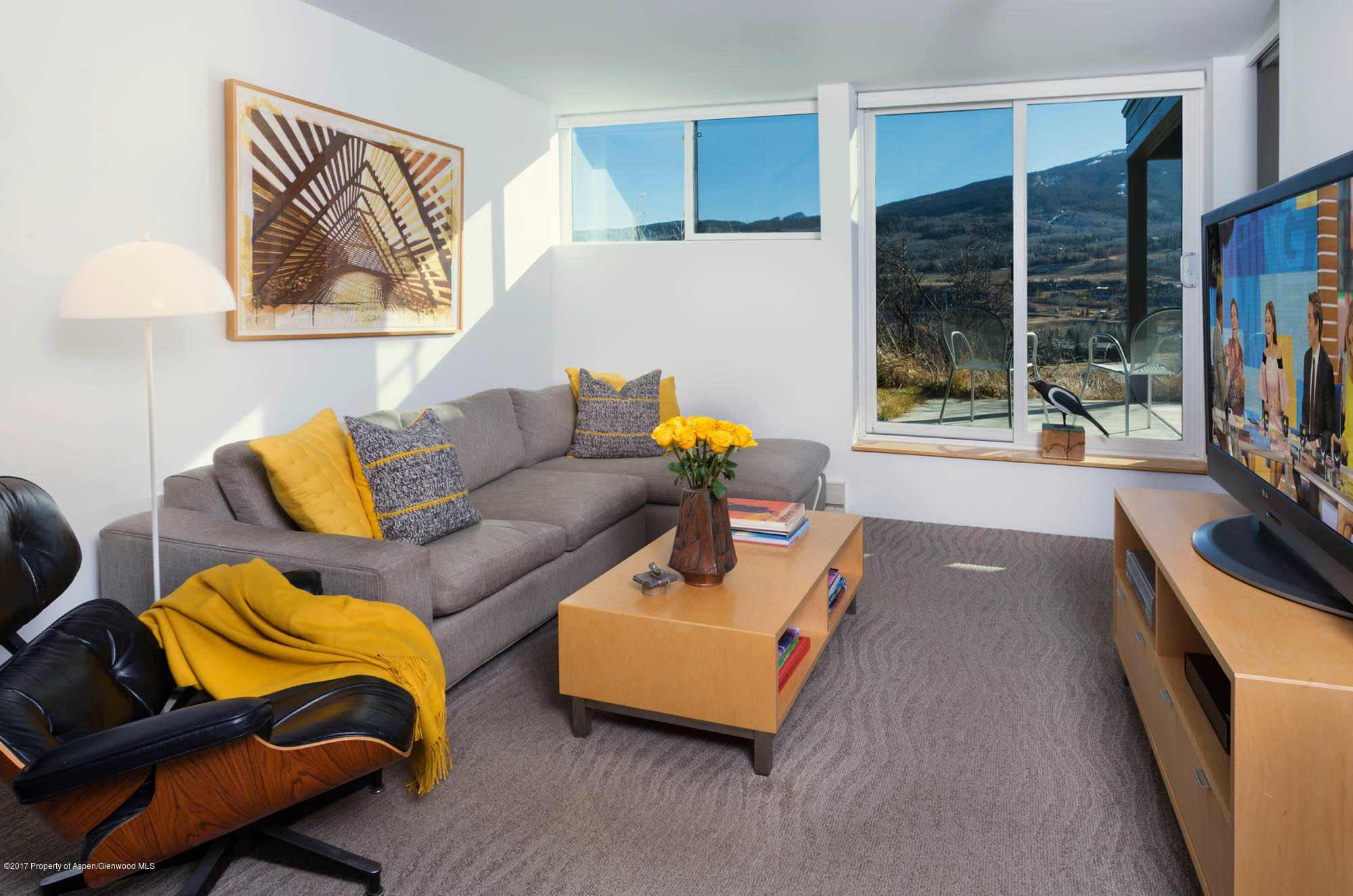 61 Oak Ridge Road Snowmass Village, CO 81615 - Photo 17 of 35 a living room with furniture and a flat screen tv