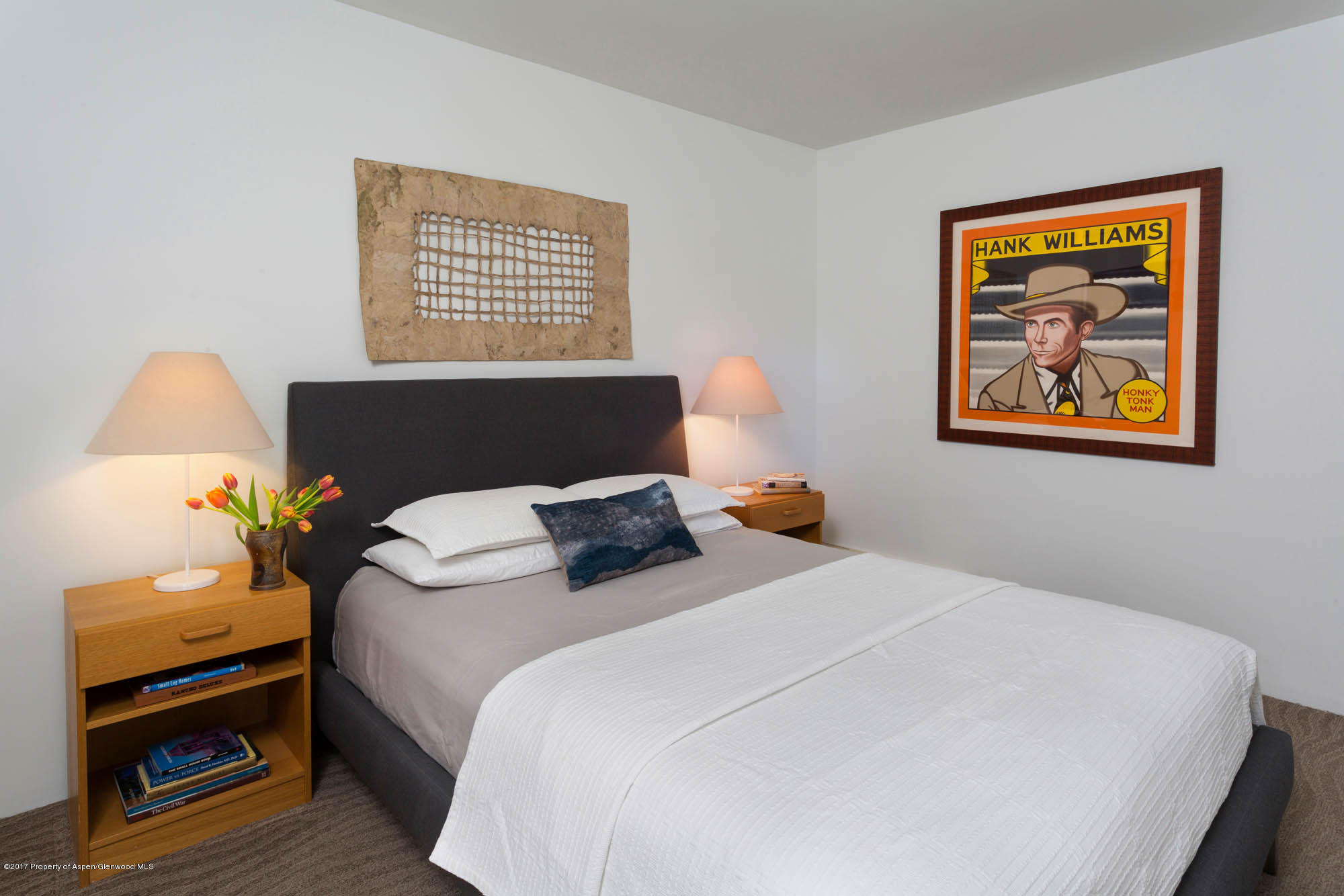 61 Oak Ridge Road Snowmass Village, CO 81615 - Photo 20 of 35 a bedroom with a bed and a painting on the wall