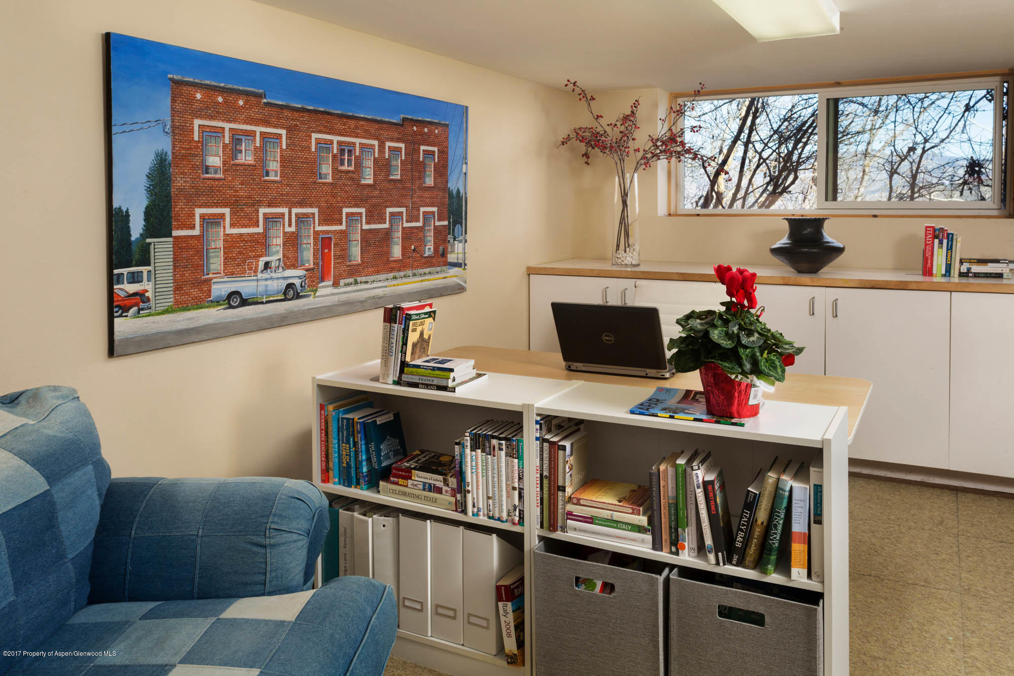 61 Oak Ridge Road Snowmass Village, CO 81615 - Photo 23 of 35 a living room with furniture a flat screen tv and a floor to ceiling window