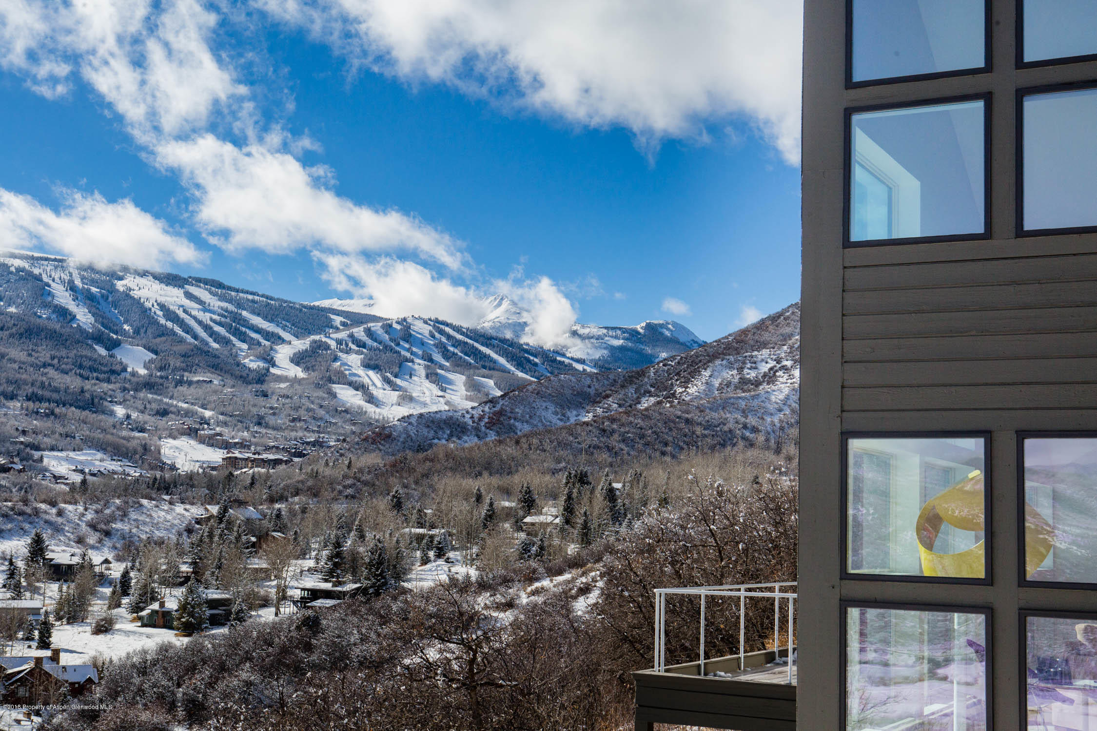 61 Oak Ridge Road Snowmass Village, CO 81615 - Photo 25 of 35 a view of a brick building from a balcony