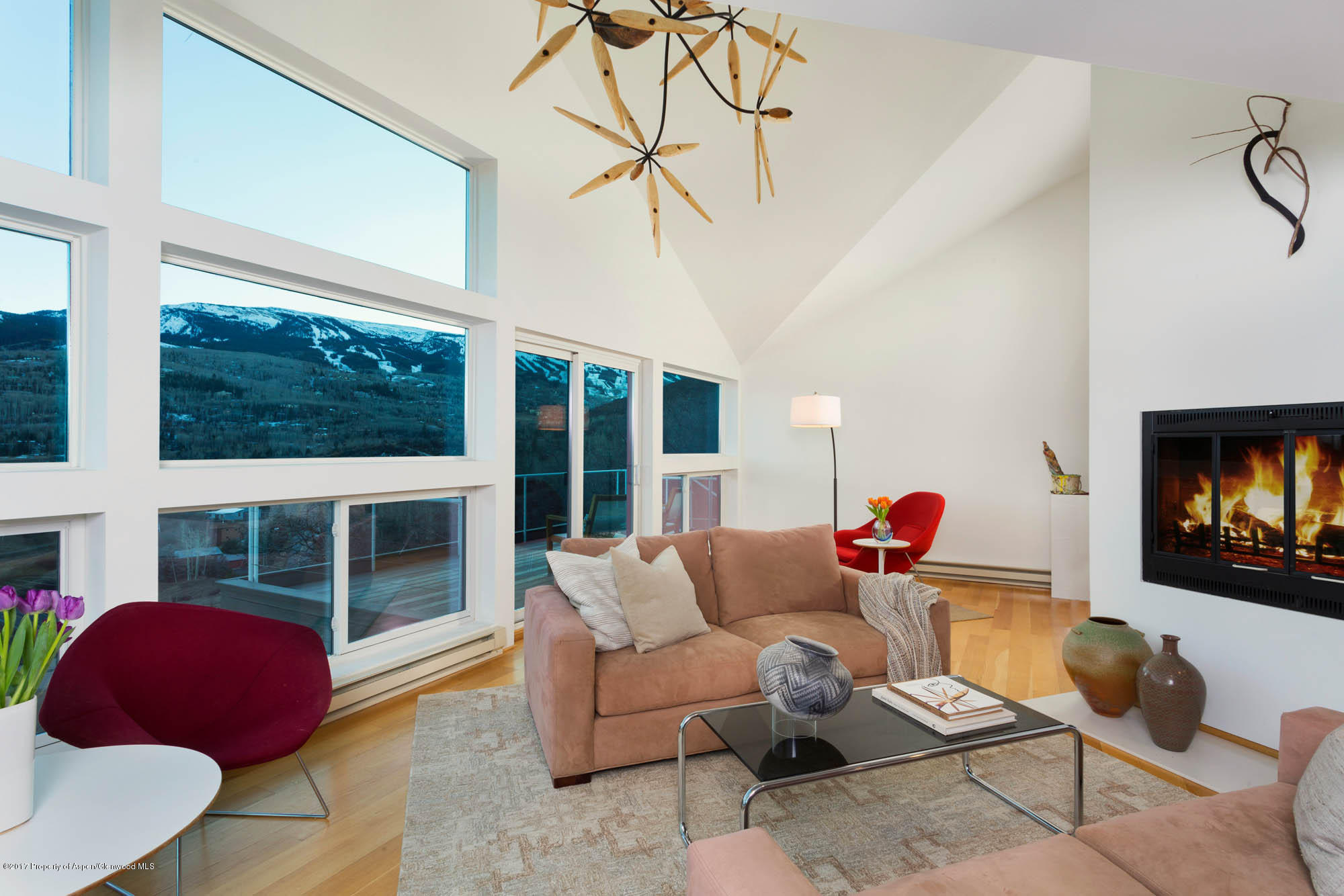 61 Oak Ridge Road Snowmass Village, CO 81615 - Photo 4 of 35 a living room with furniture and a fireplace